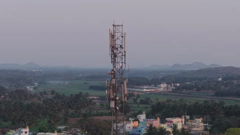 Circling drone shot of a telecom tower in rural India Stock Footage 305259504