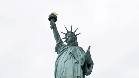 Circling hyper lapse of the statue of liberty isolated over a white sky. Stock Footage 118904005
