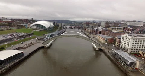Circling over opened Gateshead Millenium Bridge over River Tyne Stock Footage 159133457