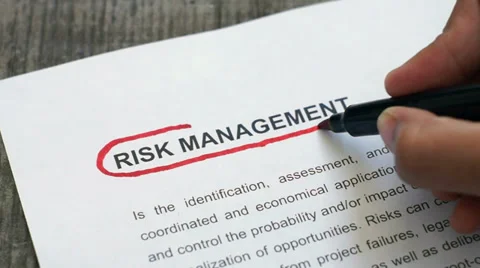 Circling Risk Management with a red marker Stock Footage 32156936