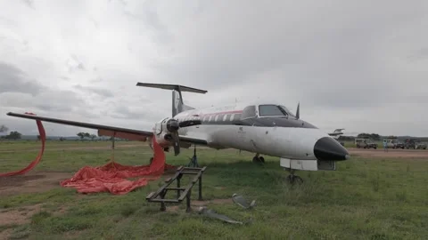 Circling Unity Air plane deserted in Mikumi national park after landing gear Stock Footage 305447985