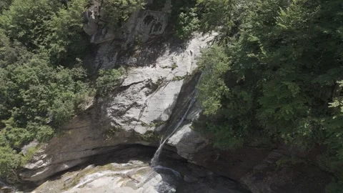 Circling a waterfall in the forest Stock Footage 288719137
