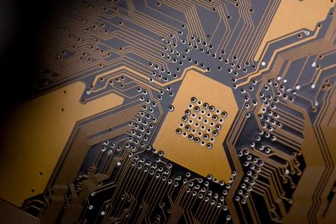 Circuit board abstract background texture. Macro close-up. Orange PCB. Muted Foto stock