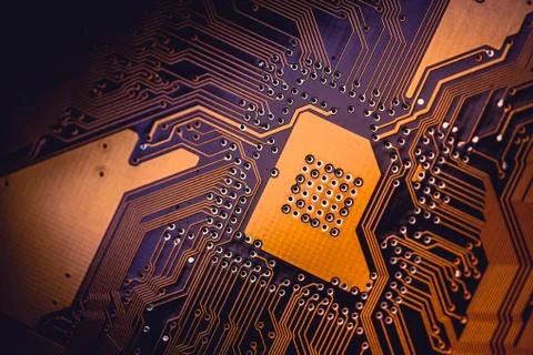 Circuit board abstract background texture. Macro close-up. Orange PCB. Stock Photos