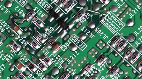 Circuit board with components in rotation. Extreme close up Stock Footage 299947201