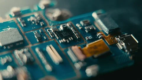 Circuit Board Macro View Showing Electronic Components on a Blue Surface 库存影片 331164599