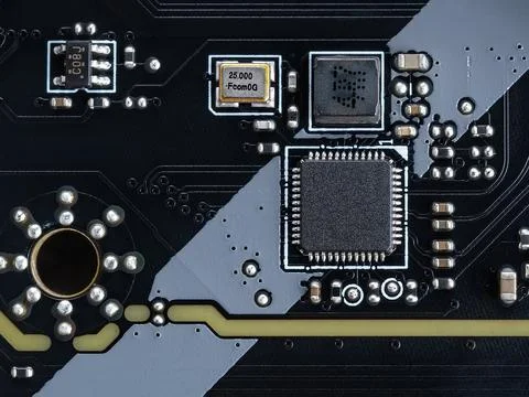Circuit board with microchips and electronic components on a modern motherboard Stock Photos