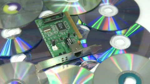 Circuit board over CD rack focus Stock Footage 316541