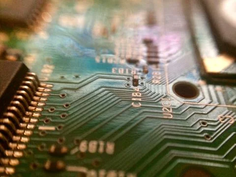 Circuit board with surface mounted devices selective focus at oblique angle Stock Photos