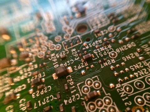Circuit board with surface mounted devices selective focus at oblique angle Stock Photos