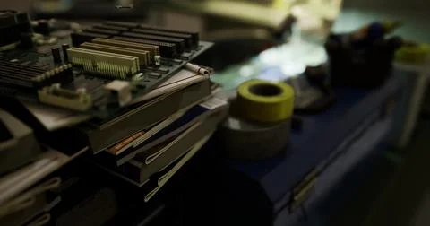Circuit boards and tools on a workbench during a late night electronics proje Stockillustratie