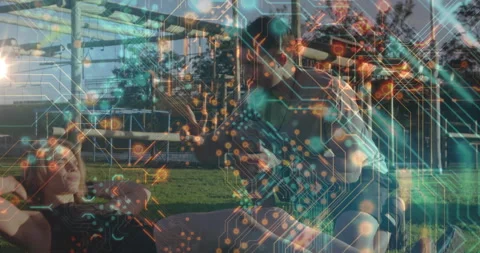 Circuit pattern animation over people exercising outdoors on green grass Stock Footage 305288390