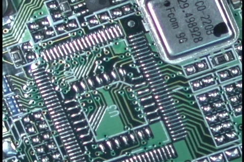 Circuits and wires comprise a computer circuit board. Stock Footage 340132