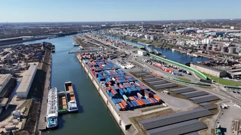 Circular aerial above container terminal and moored boats Stock Footage 331896847