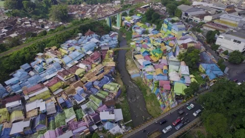 Circular aerial drone view of the rainbow village in Malang (Jodipan), Java Video stock 295359246