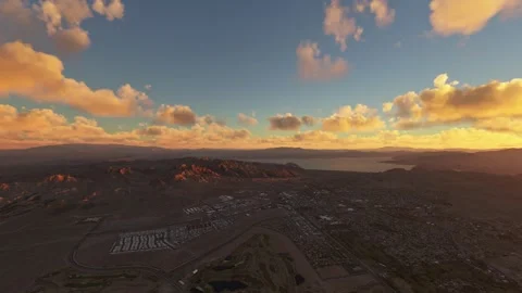 Circular aerial drone view at sunset of Boulder City in Nevada. United States Видео 278347963