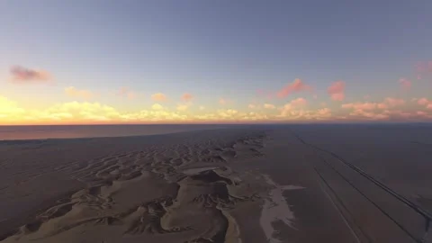 Circular aerial drone view at sunset of Dune 7 in Walvis Bay. Namibia 库存影片 328279469