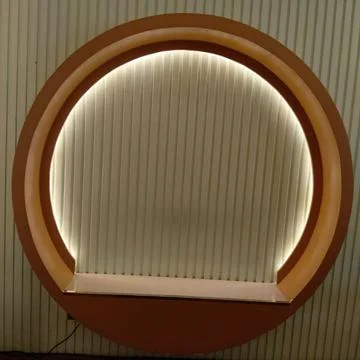 Circular architectural element with illuminated vertical slats Stock Photos