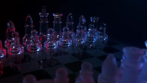 Circular camera movement around a modern glass chess set showcasing dynamic focu Video stock 347189813