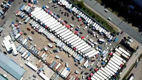 Circular camera panorama over food trailers on the market by copter Stock Footage 93449028