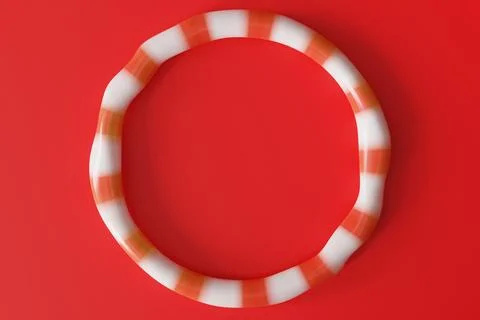 A circular candy design sits on a solid red background. This 3D render show.. Stock-Illustration