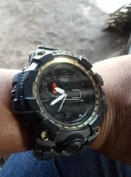 Circular clock on hand Stock Photos