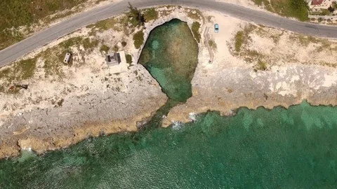 Circular Coastal Rock Cave Filled With Water, Eight Mile Rock Bahamas Aerial Stock Footage 89391204