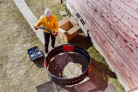Circular compost bin structure expanding with additional molded panels during Stock Photos