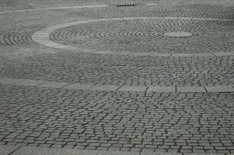 Circular concentric cobblestone pavement pattern Stock Photos