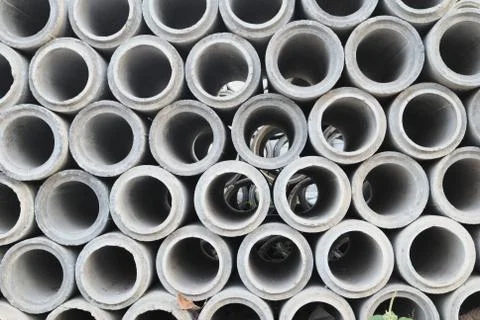 A circular concrete pipe that is placed in layers Stock Photos