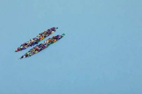 Circular crushed plastic pellets, two lines made of recycled particles Stock Photos