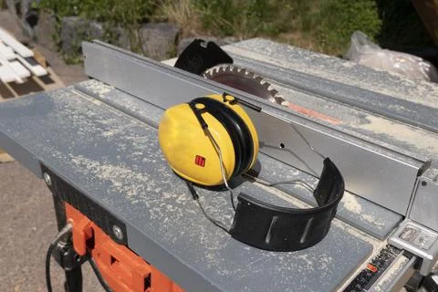 Circular cutting machine with headphones Stock Photos
