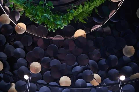 Circular discs on the ceiling with glowing lanterns Stock Photos