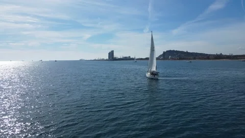Circular drone flight around sailing boat near coast Stock Footage 331849302