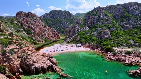 Circular drone shot of the beach of Li Cossi in Sardinia Stock Footage 260636779