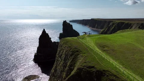 Circular drone shot of Duncansby Stacks, Scotland Stock Footage 260605937