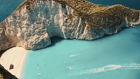 Circular drone shot over Navagio beach in Zakynthos Stock Footage 291670923