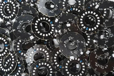 Circular electronic plates contain LED light elements within a filled frame.. Stockfoto's