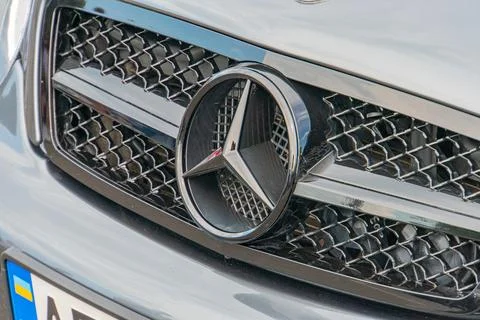 A circular emblem featuring an interlinked double-headed arrow dominates th.. Stock Photos