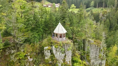 Circular flight of a gazebo on the edge of a cliff in the Black Forest Stock Footage 182036975