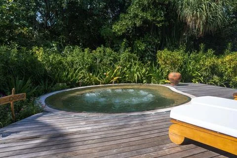 Circular hot tub on timber deck at a private villa in the Maldives 스톡 사진