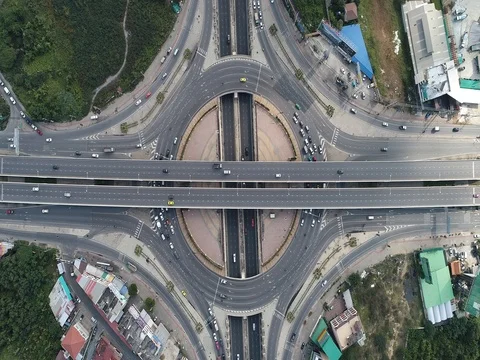 Circular intersection traffic road day time Stock Footage 83206197