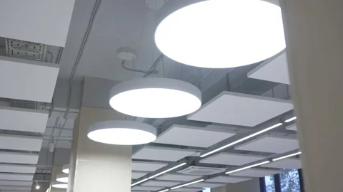 Circular LED lights decorate geometric ceiling with futuristic elegance Stock Footage 310775385