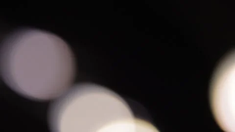 Circular lights of various sizes in the darkness 스톡 동영상 317490009