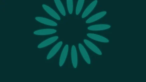 A circular loading icon made of teal petals on a dark background display Video stock 335117990