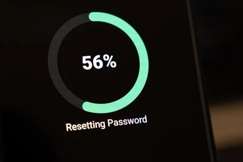Circular loading indicator at 56 percent with Resetting Password text on a dark Stock Photos