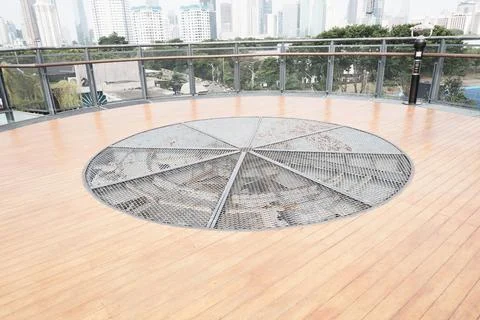 Circular Metal Hatch on Rooftop Deck with City View Stock Photos