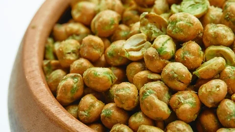 Circular motion beans with wasabi sauce in wooden bowl, isolated on white bac Stock Footage 116388252