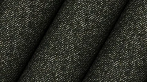 Circular motion displaying rolls of Italian dark gray melange wool cotton 動画素材 343211419