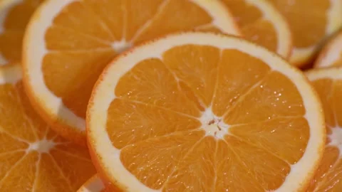 Circular Motion of Orange Slices on Spinning Surface. Stock Footage 324896877